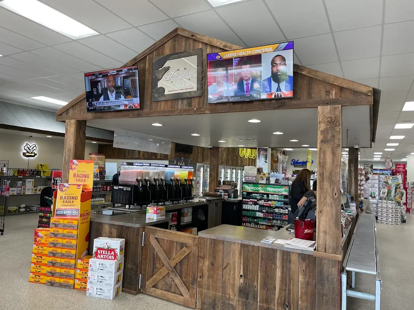 Barn-wood checkout counter and slushie machines at Brewie Louie's